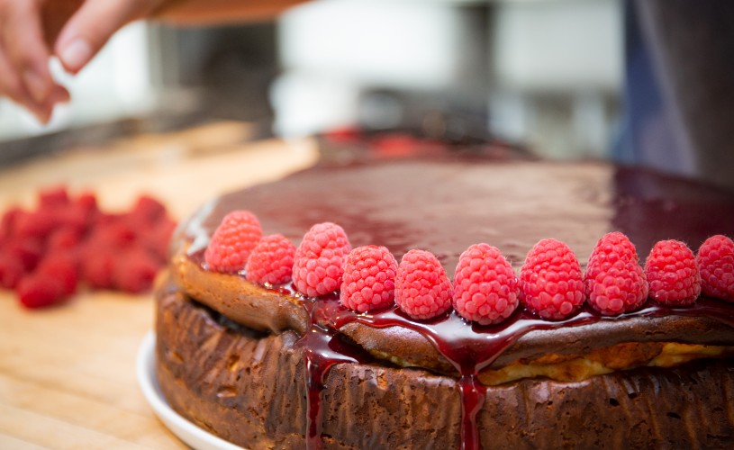 Cake topped with raspberries from Papadeli